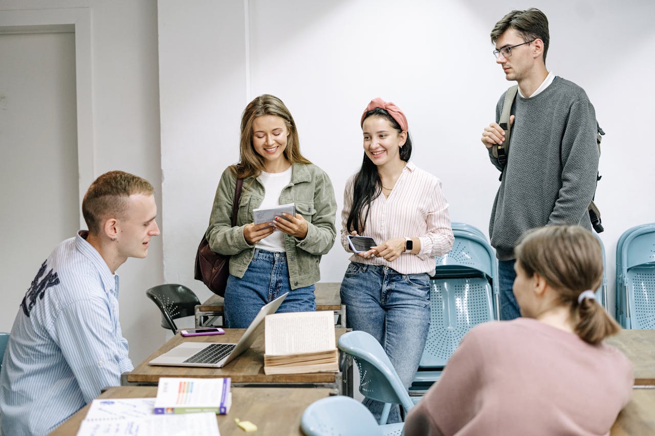 why-choose-us A diverse group of college students engaging in a lively study session indoors.